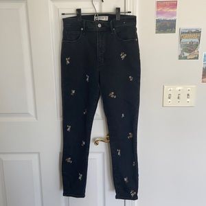 Black denim pants with floral embroidery